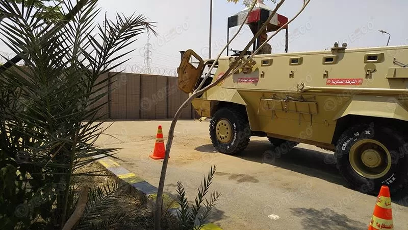 vehicles protected by hesco defensive barrier