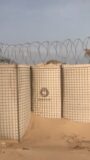 In the Gulf of Aden, the JOESCO military barriers stand tall in the wind