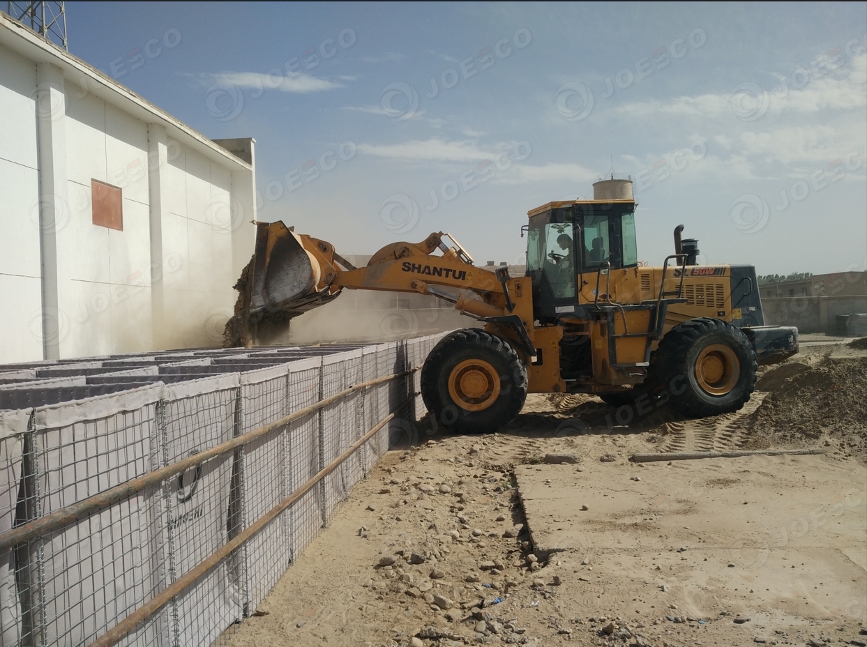 fill hesco barrier with front loader